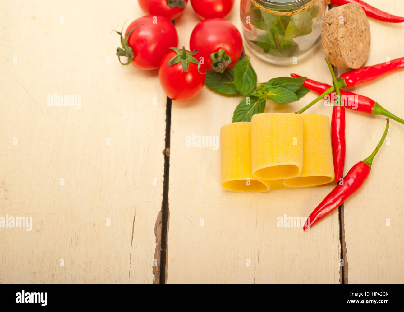 Italian pasta paccheri or schiaffoni with tomato mint and chili pepper ingredients Stock Photo