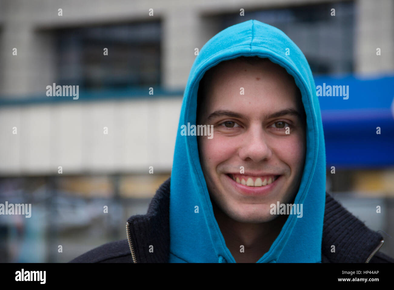 young man with a blue hood Stock Photo