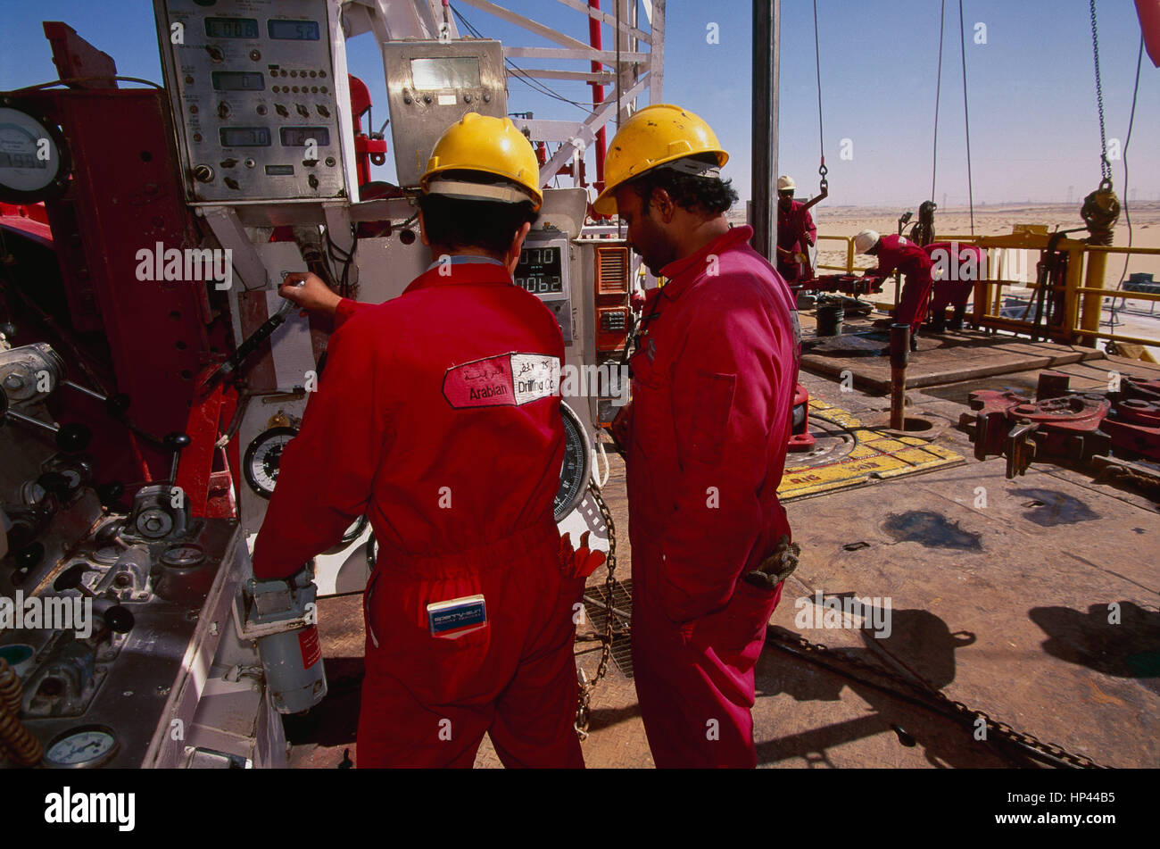 Drilling for oil in the Saudi desert near Abqaiq, by the Arabian Drilling Company, contracted by Saudi Aramco, the worlds largest oil producer. Stock Photo