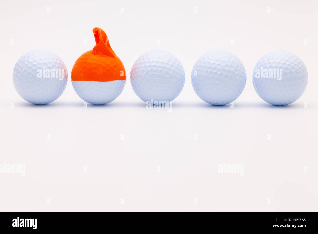 https://c8.alamy.com/comp/HP46A5/white-golf-balls-with-funny-cap-on-the-white-background-funny-golf-HP46A5.jpg