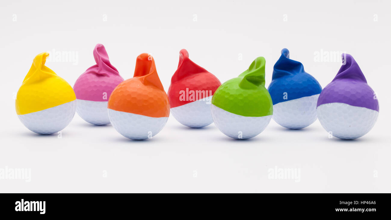 White golf balls with funny caps on the white background. Funny golf concept Stock Photo Alamy