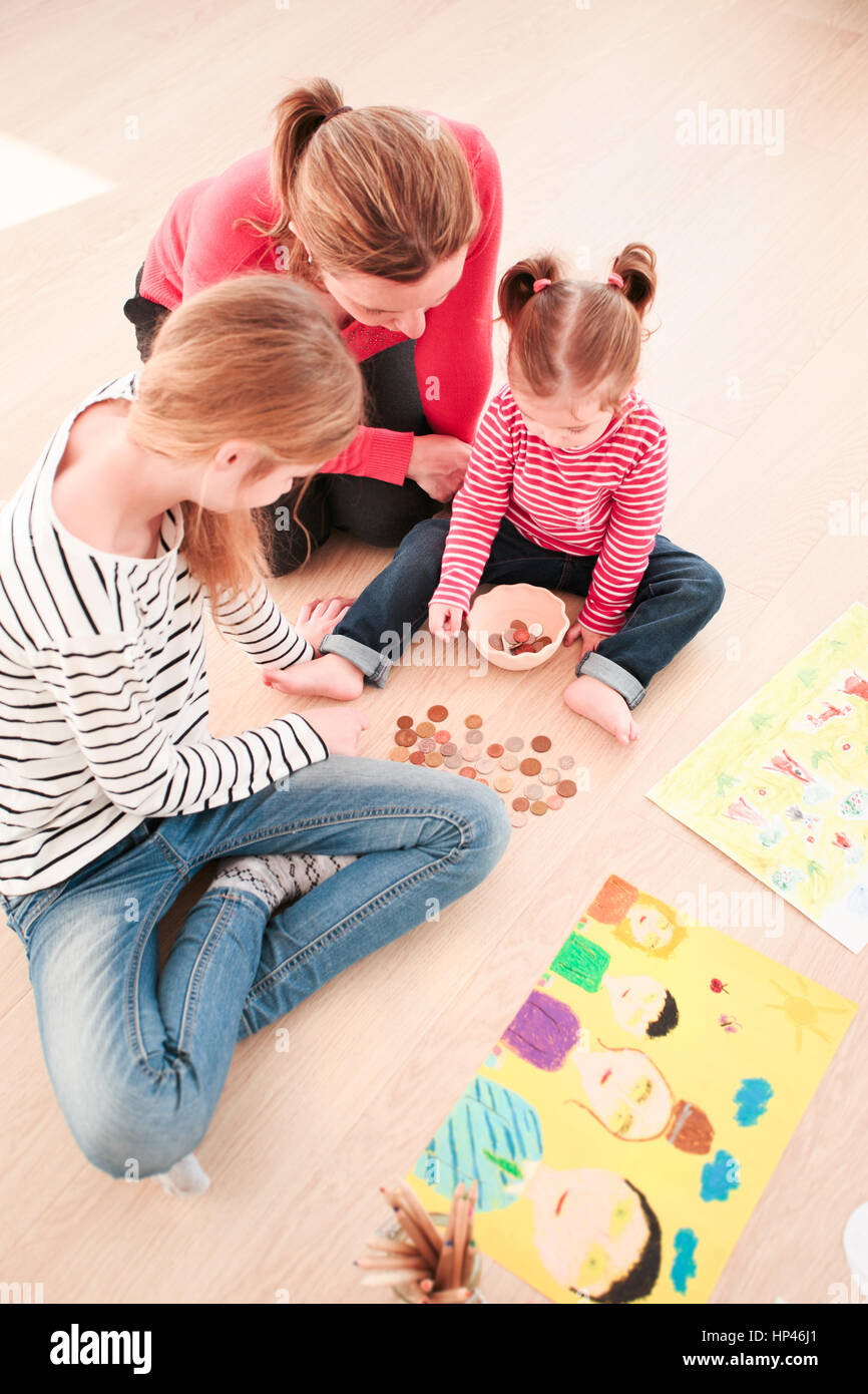 IndoorsChildren Counting Money Earned During School Fair Stock Photo 