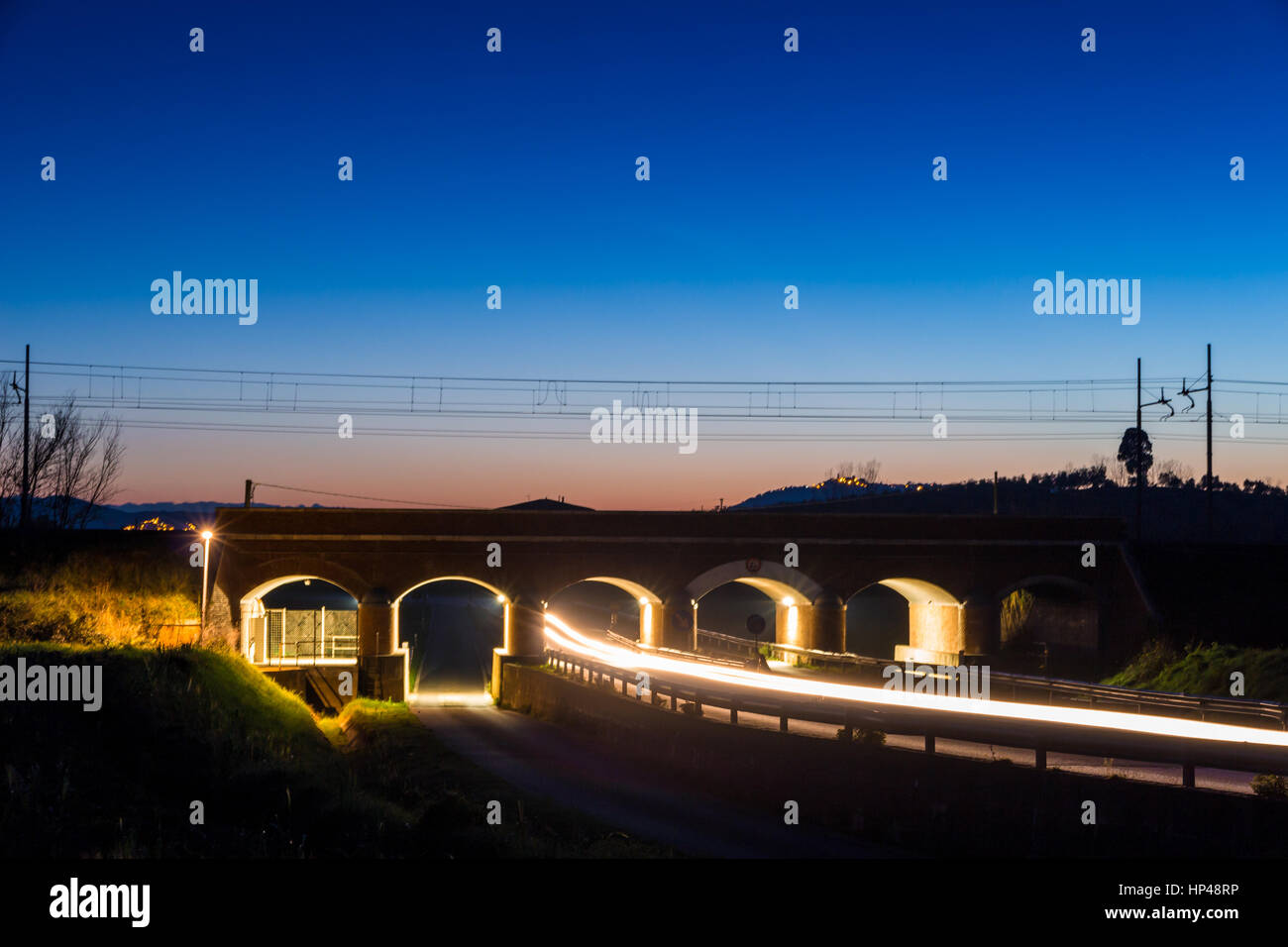 Railway bridge over road in Tuscany, Italy Stock Photo