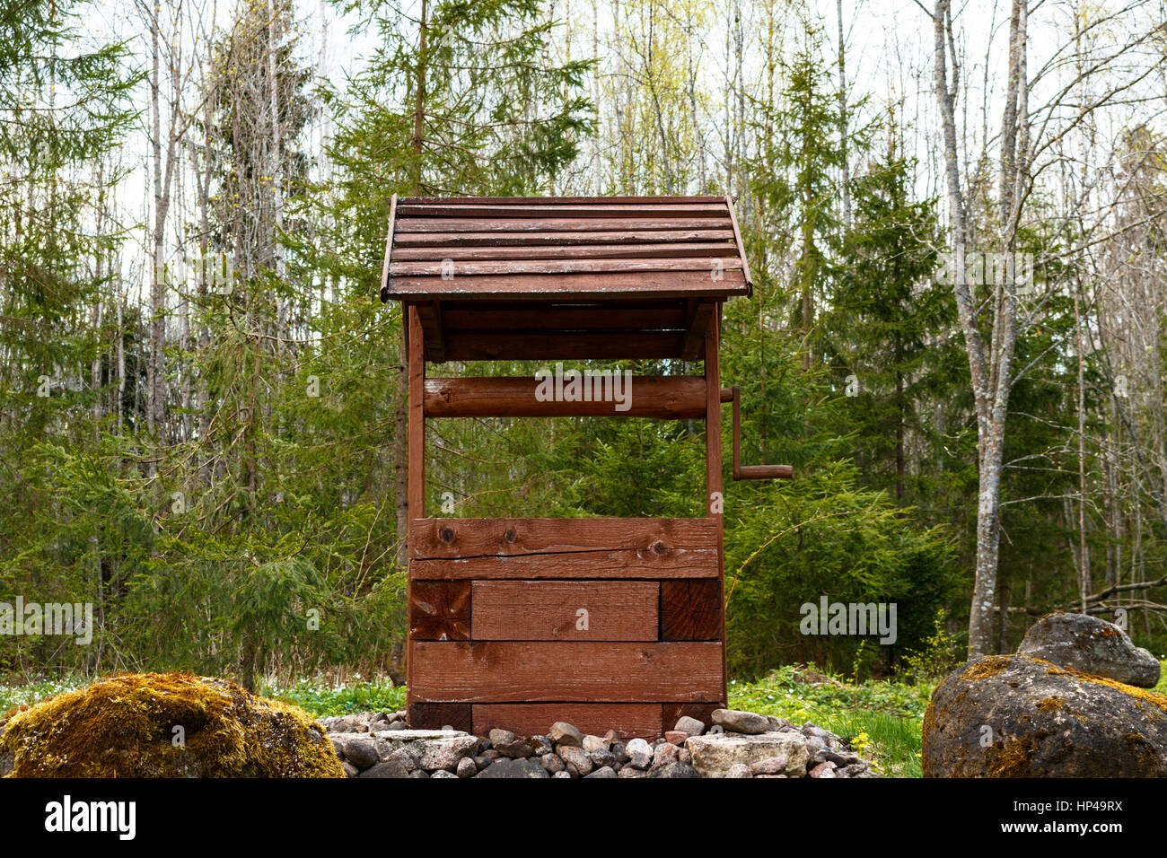 a Wooden well in the woods. spring Stock Photo - Alamy
