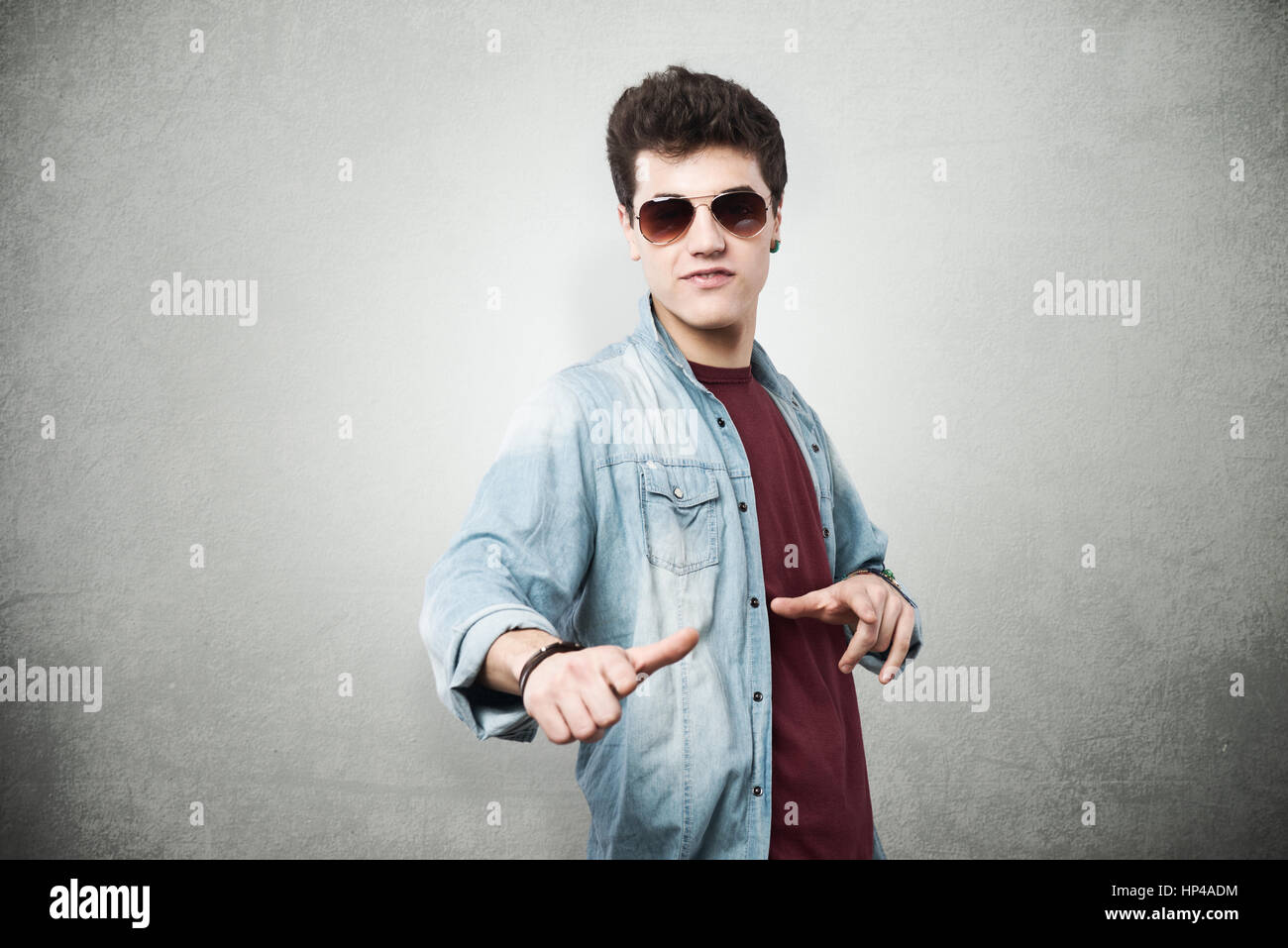 Cool guy in sunglasses enjoying and gesturing Stock Photo