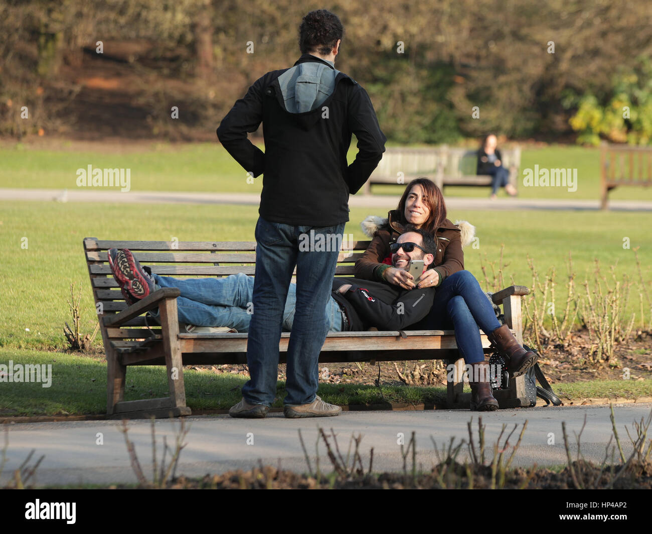 People enjoy a spell of warm weather in Regent's Park, London, as a