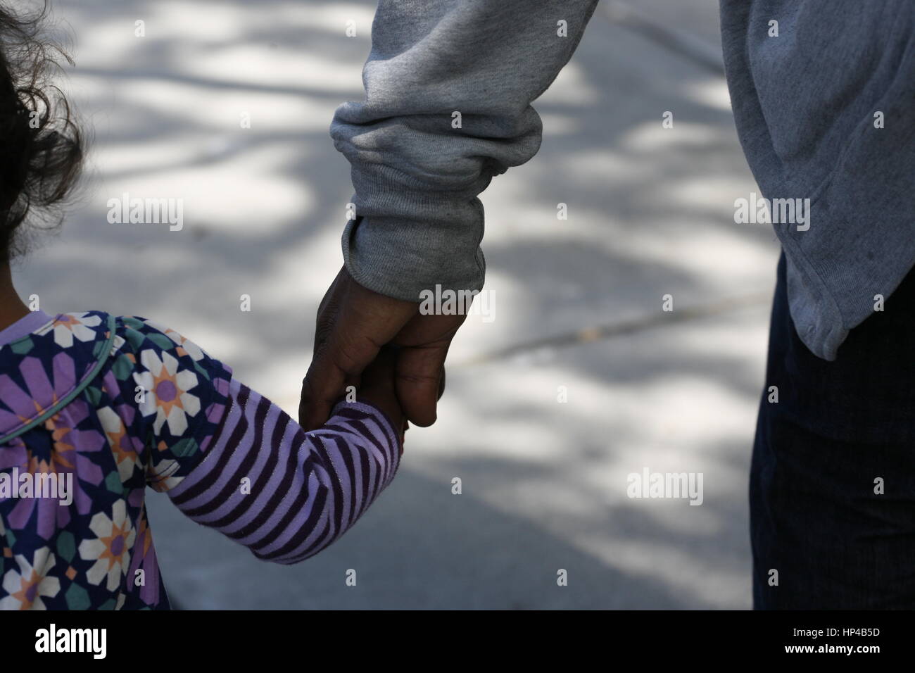 African father and son holding hands hi-res stock photography and ...