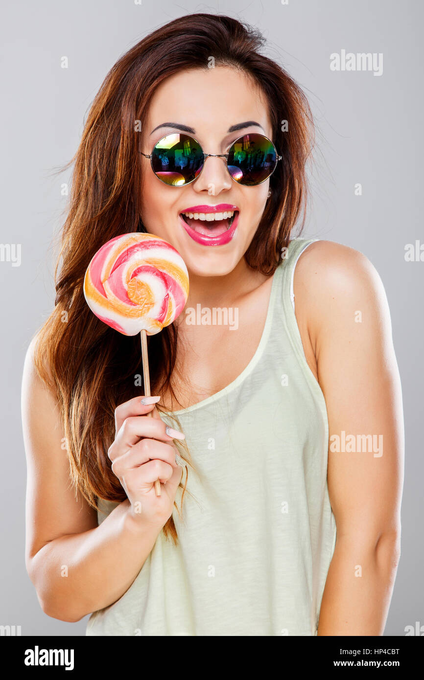 Girl With Big Colorful Candy Stock Photo Alamy