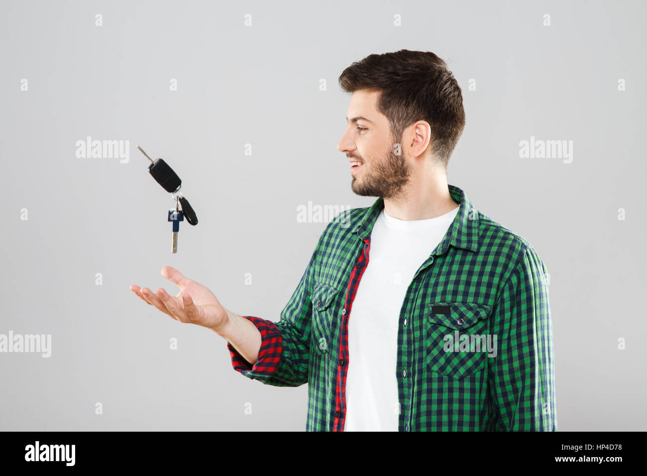 Young man throwing up car keys Stock Photo Alamy