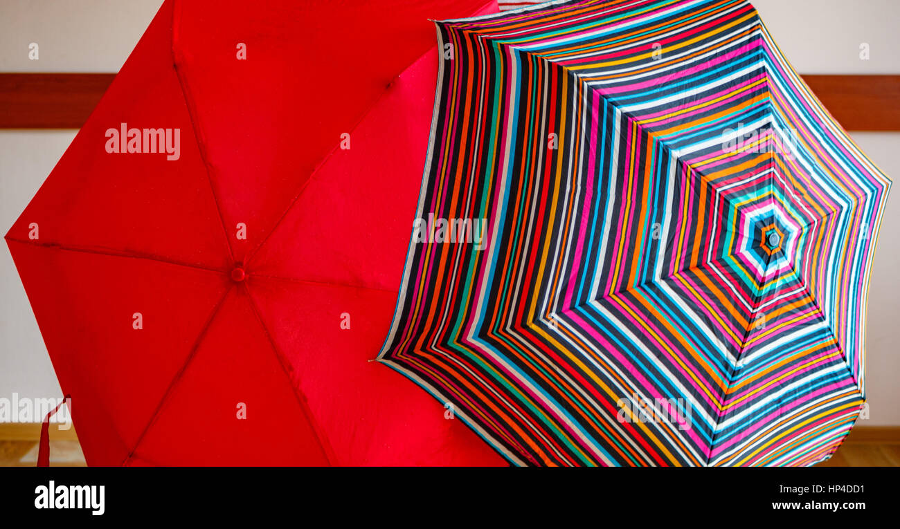 two umbrellas. red and striped. open. Stock Photo
