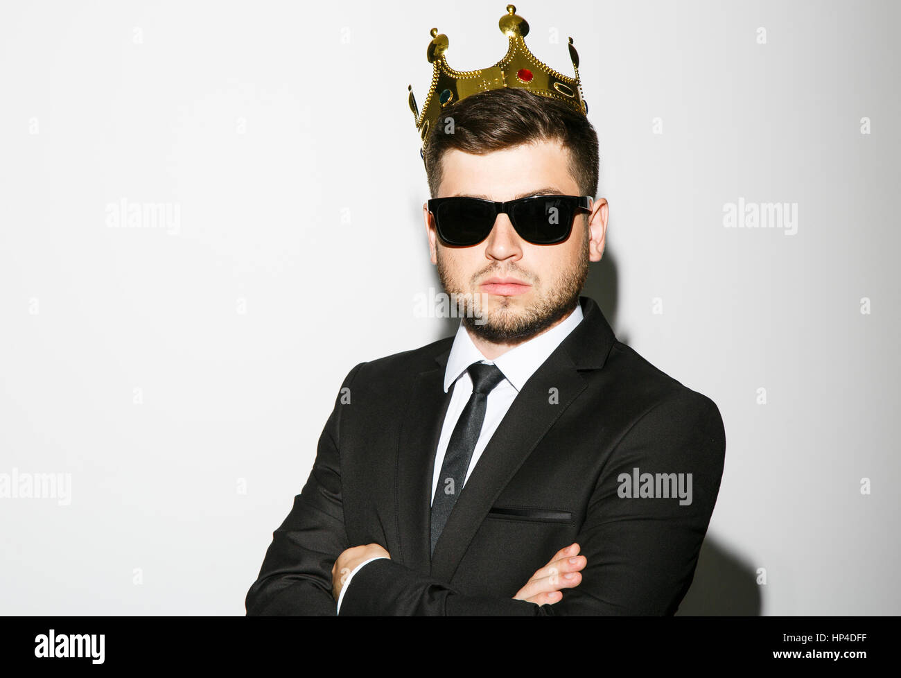Attractive man in black suit and sunglasses Stock Photo - Alamy