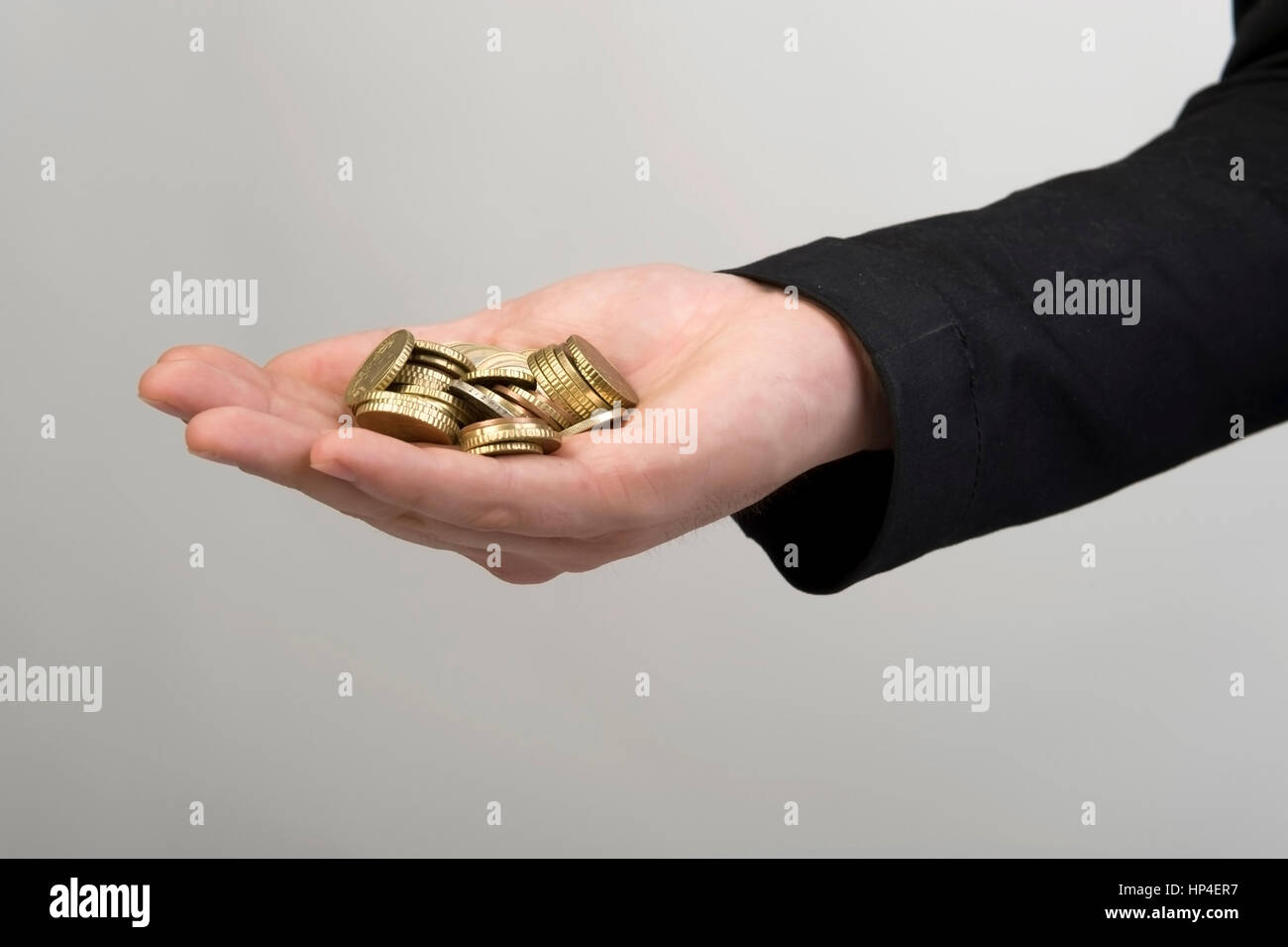 Model released , Muenzgeld in Maennerhand - coins in hand Stock Photo