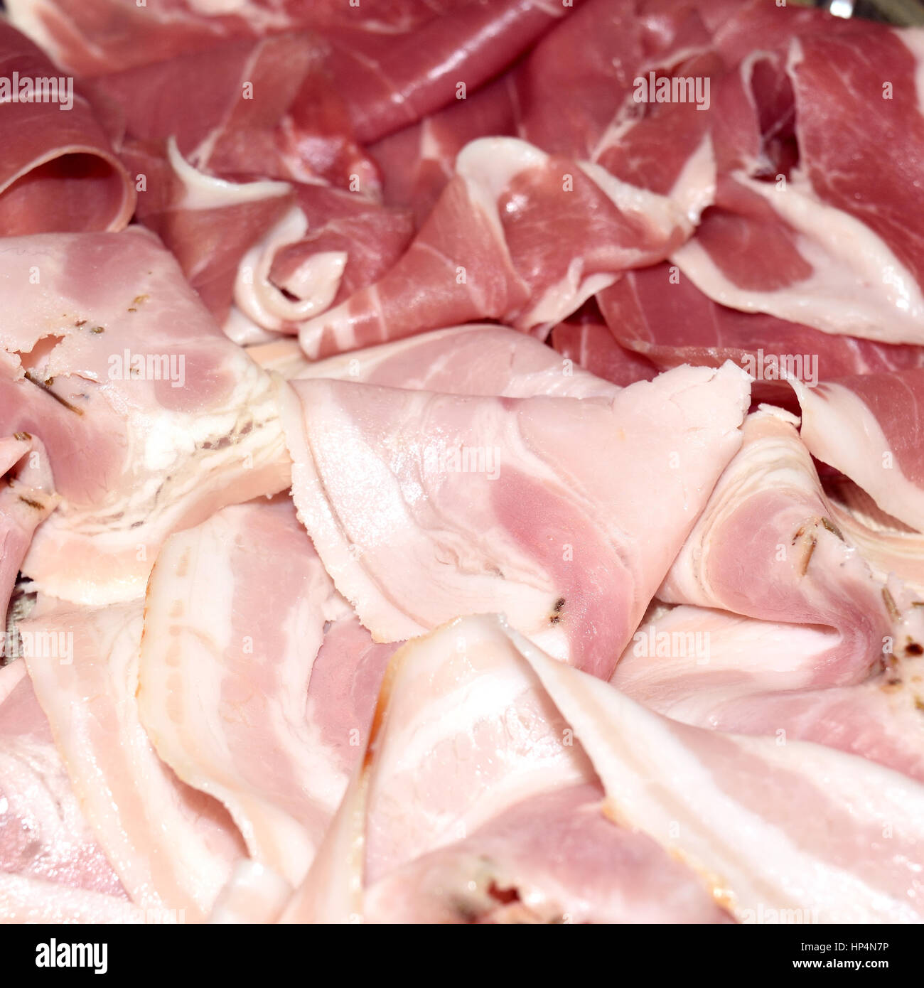 dish with thin slices of parma ham and roast pork cured meat Stock