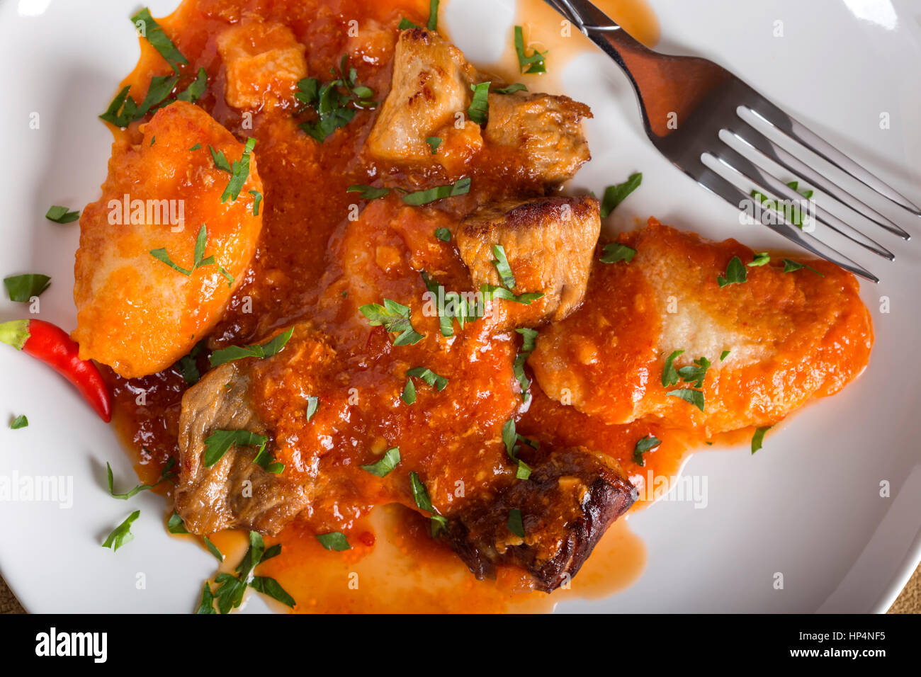 Goulash stew - hungarian traditional meal on plate with fork Stock Photo