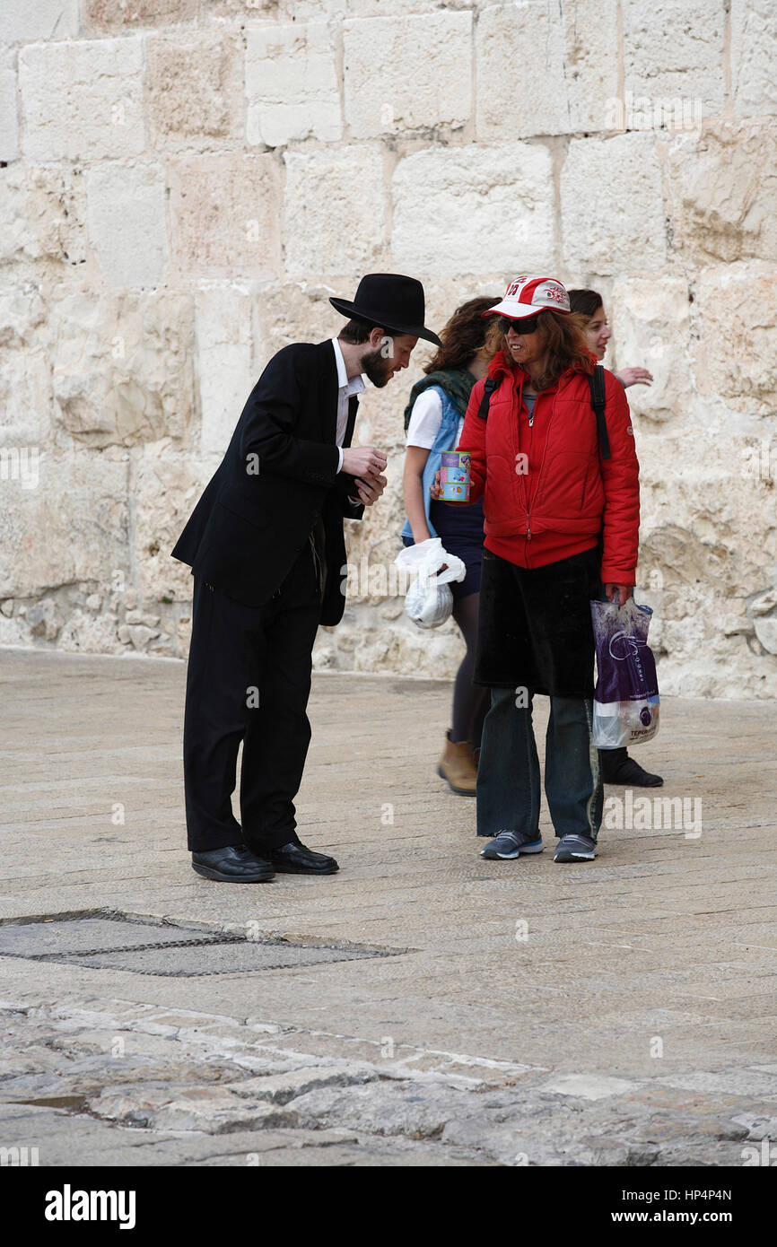 ultra-orthodox jew walking at jaffa street in western part of jerusalem, israel Stock Photo