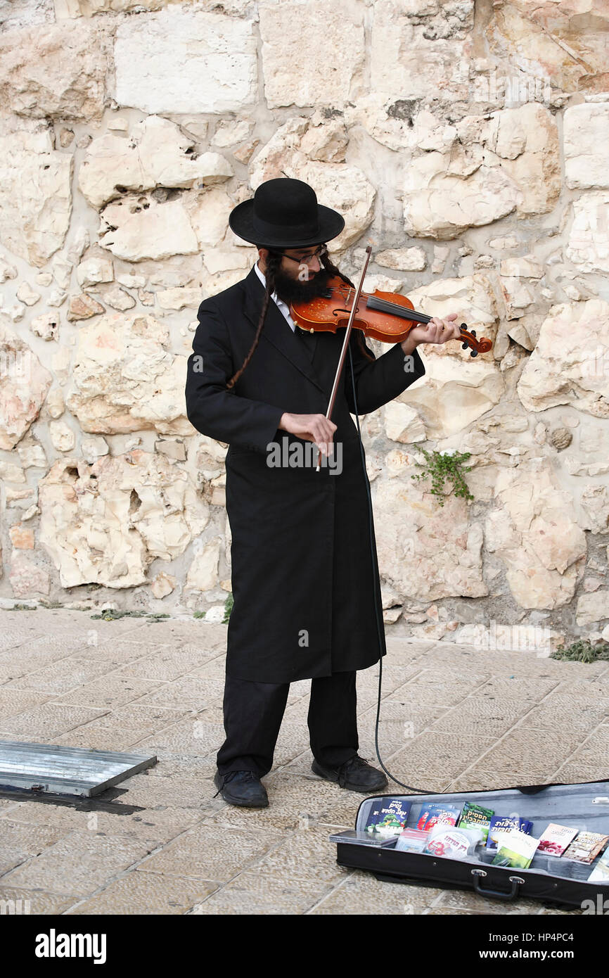 ultra-orthodox jew play violin at jaffa gate, old city, jerusalem, israel Stock Photo