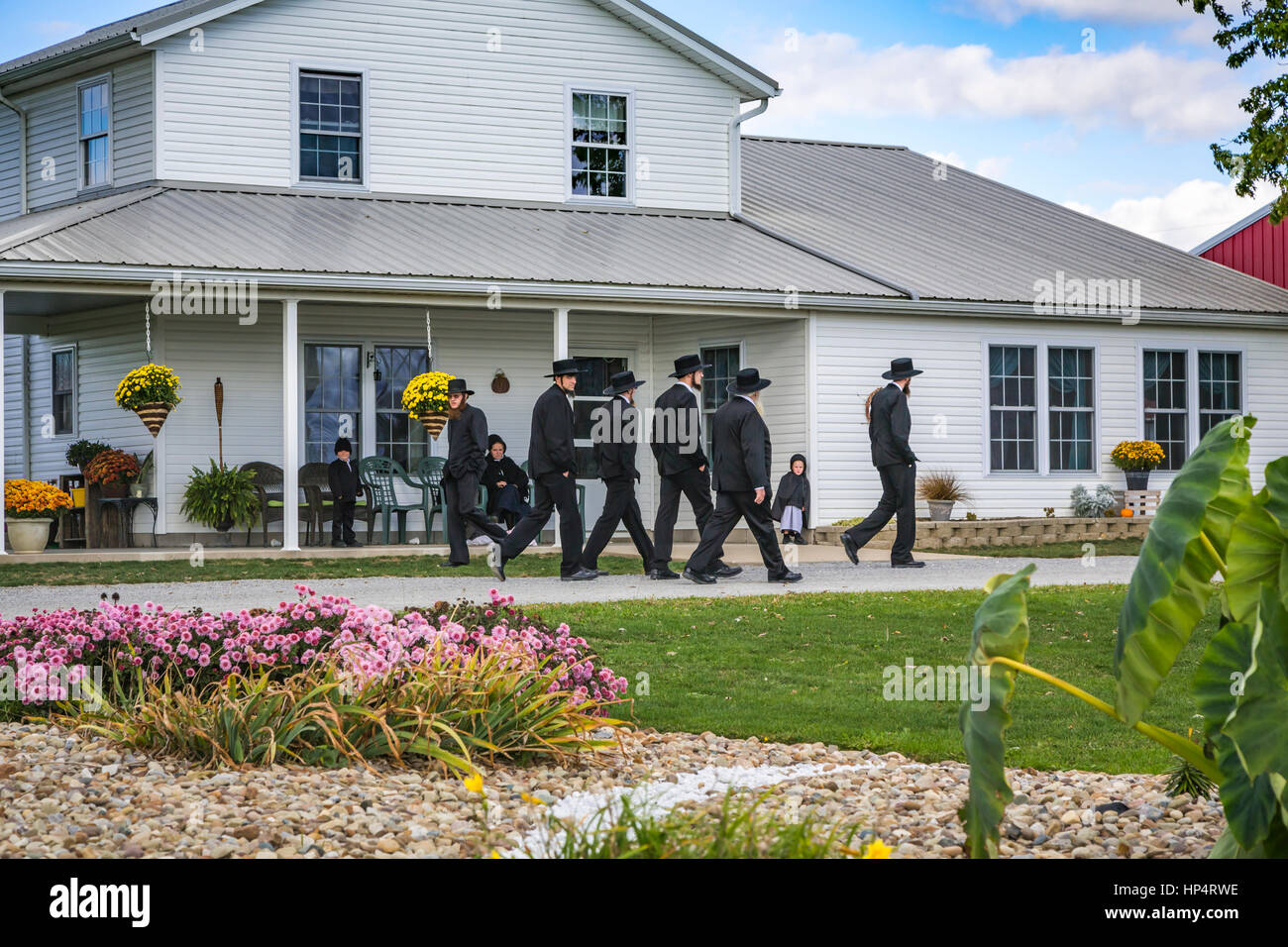 An Amish farm home with Amish men near Kidron, Ohio, USA Stock Photo