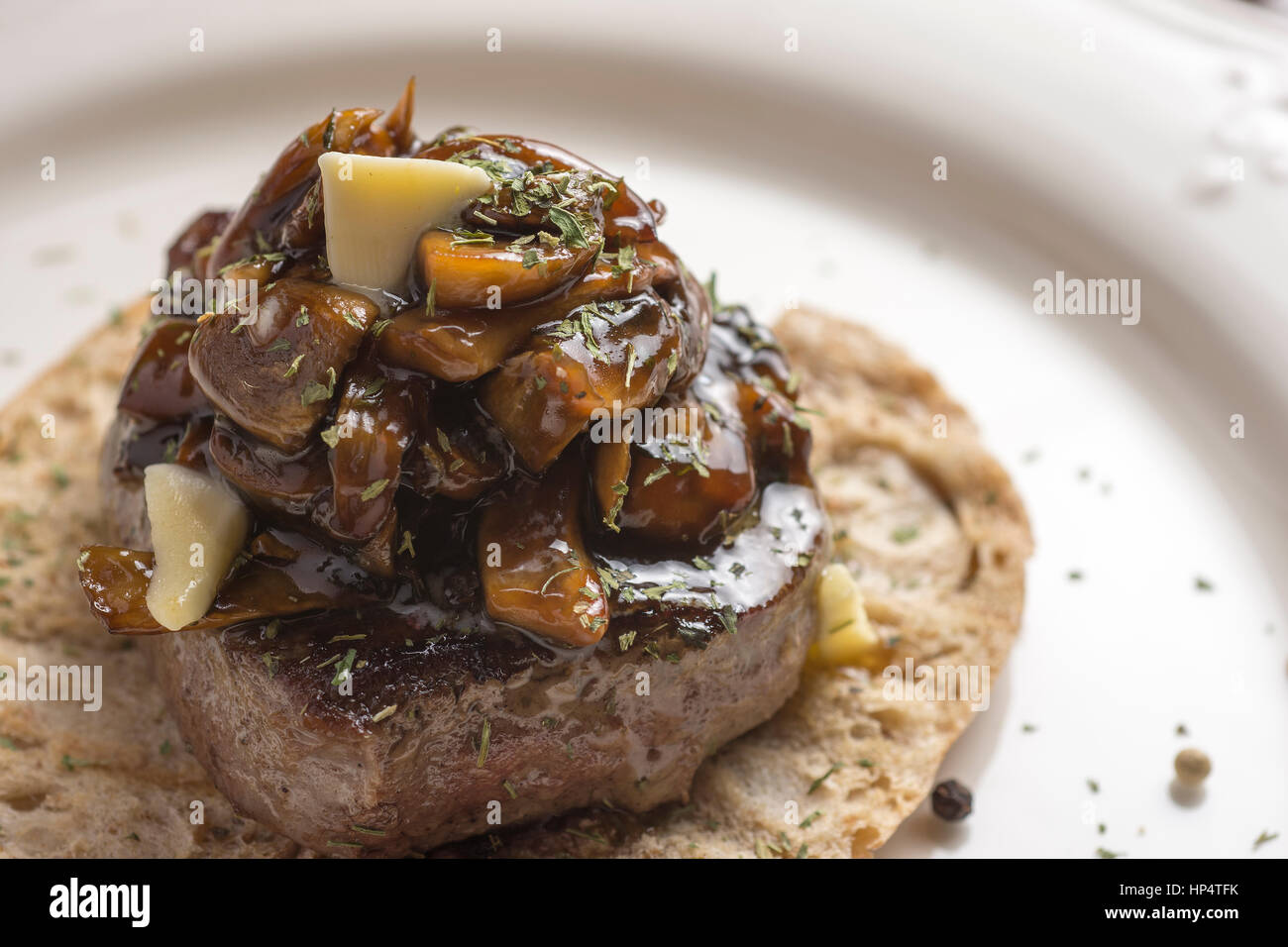 Beef Steak Fillet Covered with Mushroom Sauce on Toasted Baguette Bread