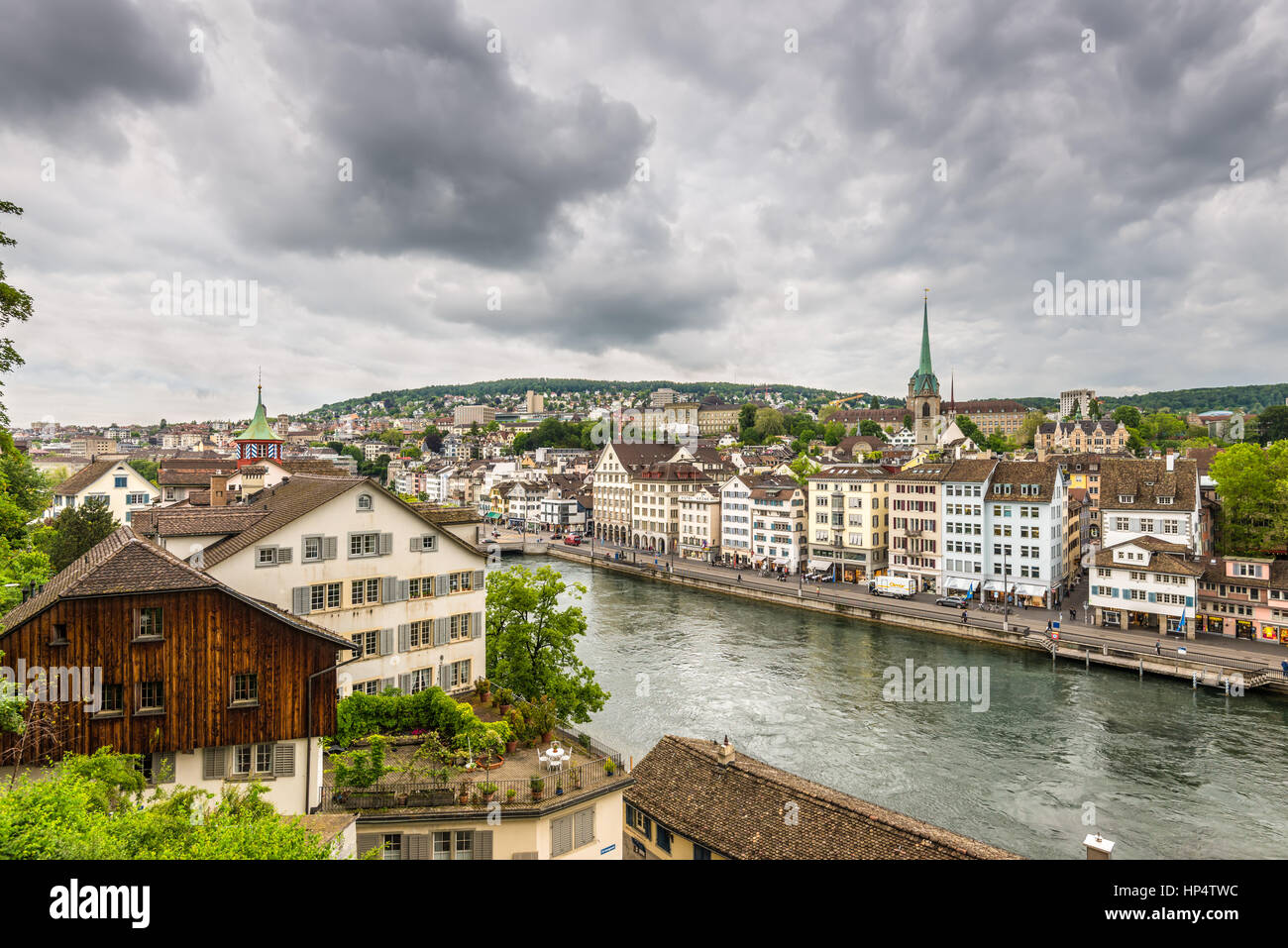 Zurich, Switzerland - May 24, 2016: Architecture of Zurich. Aerial view of Zurich old town and River Limmat from Lindenhof in Zurich on a cloudy day,  Stock Photo