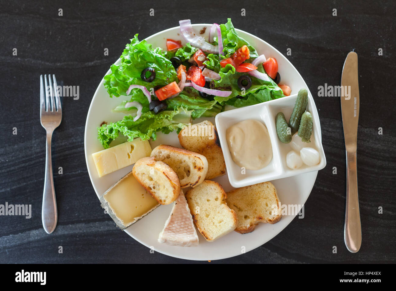 A French chesse plate with Tomme, Belkot, and Saint Marcellin cheeses