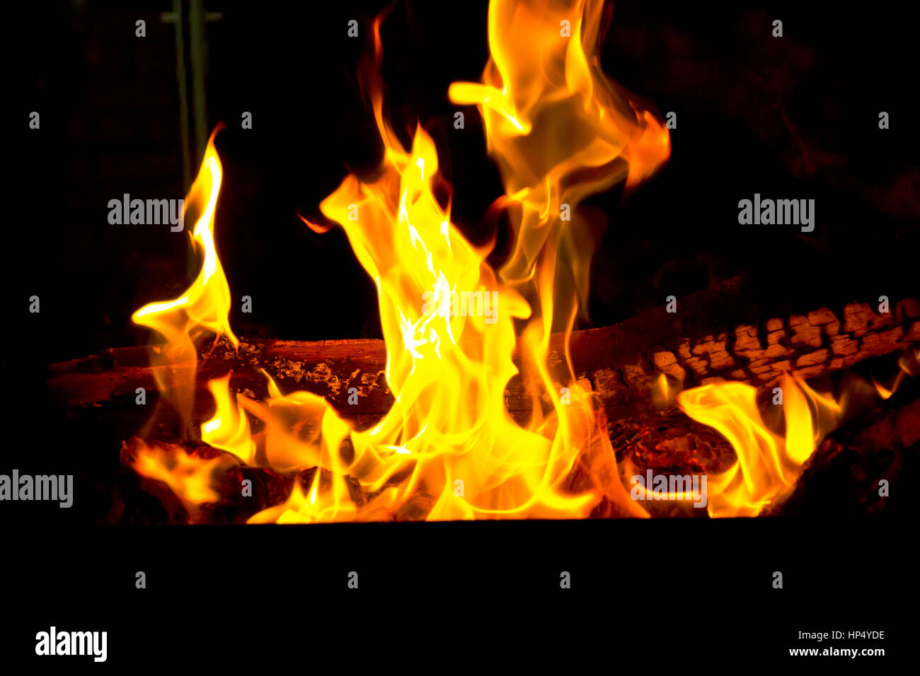 Photo of red fire flame on black background Stock Photo - Alamy