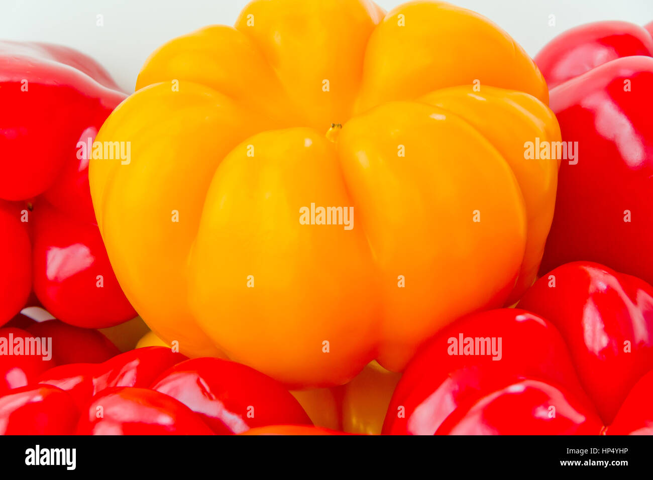 Photo of red and yellow raw pepper on white background Stock Photo - Alamy