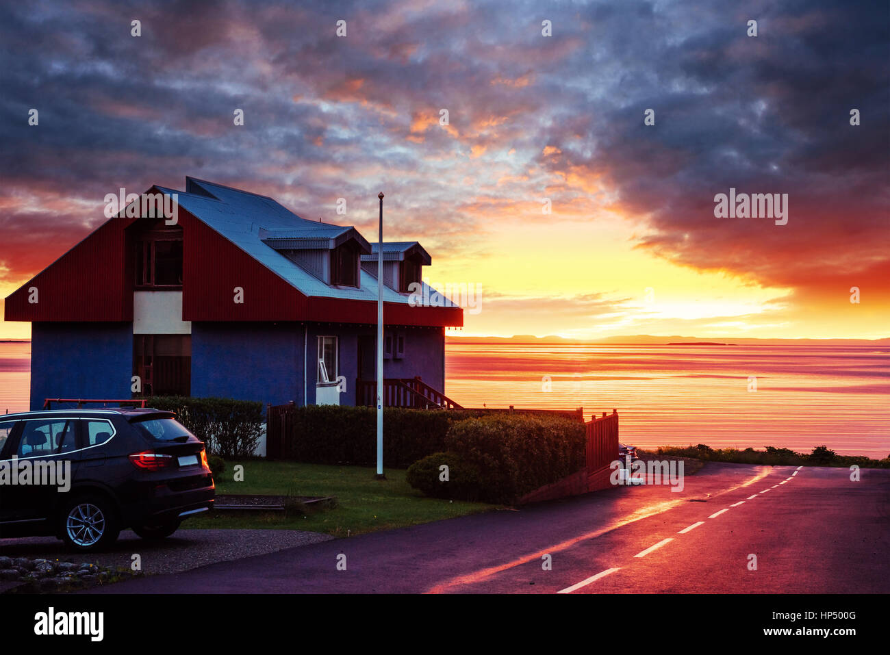 house on the beach at sunset water Stock Photo - Alamy