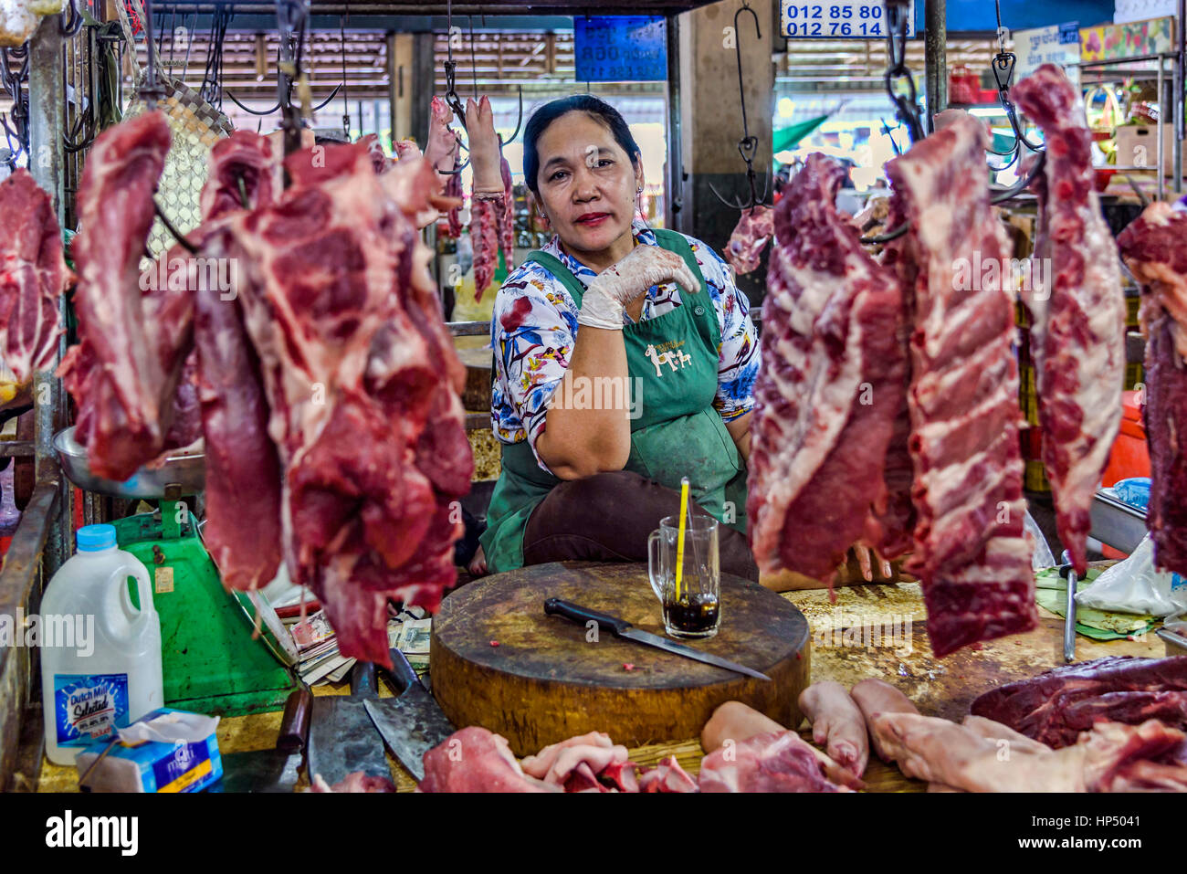 Phnom Penh, Cambodia - December 30, 2016: An unidentified woman posing in her butcher shop located in Cambodia's capital city central market Stock Photo