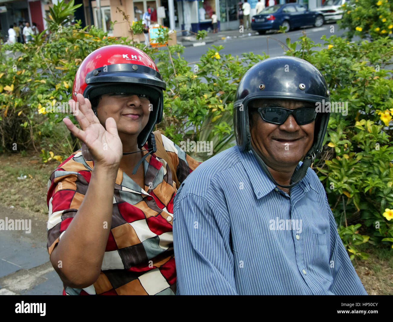 Couple on motorcycle, helmets, Port Louis, road traffic, traffic jam, Mauritius, Port Louis, street traffic, traffic jam Stock Photo