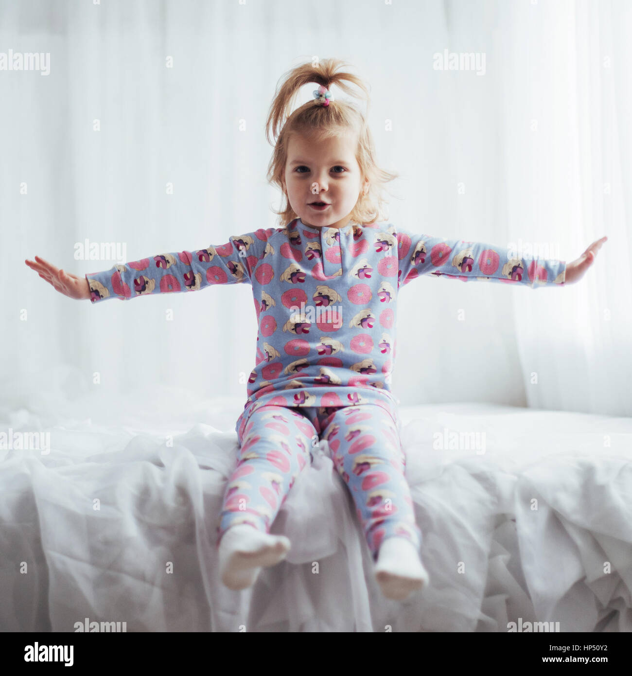 A 10-12-year-old Girl in Pink Pajamas Shows a Heart Sign with Her Hands  Against the Background of Nature. Stock Photo - Image of girl, person:  260526280