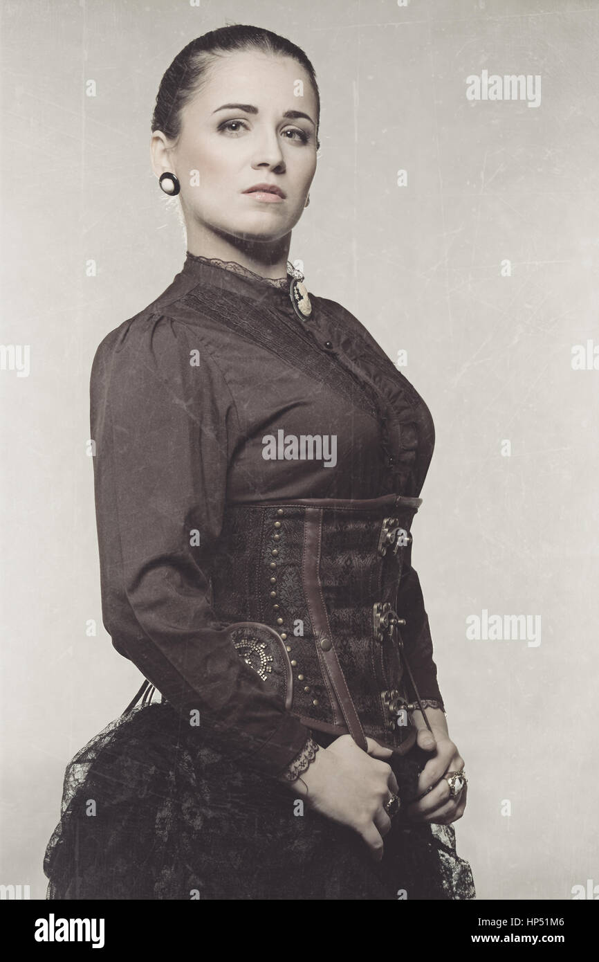 Woman in steampunk costume. Photo stylized old Stock Photo
