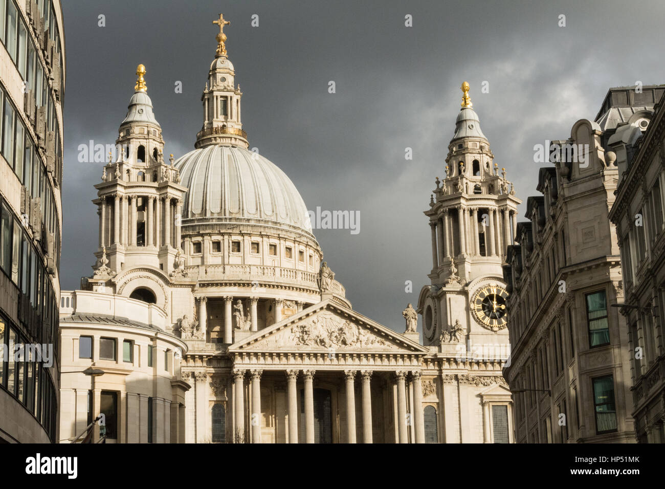 A closeup view of the Dome of St Paul's Cathedral set against a dark foreboding sky, City of London, England, UK Stock Photo