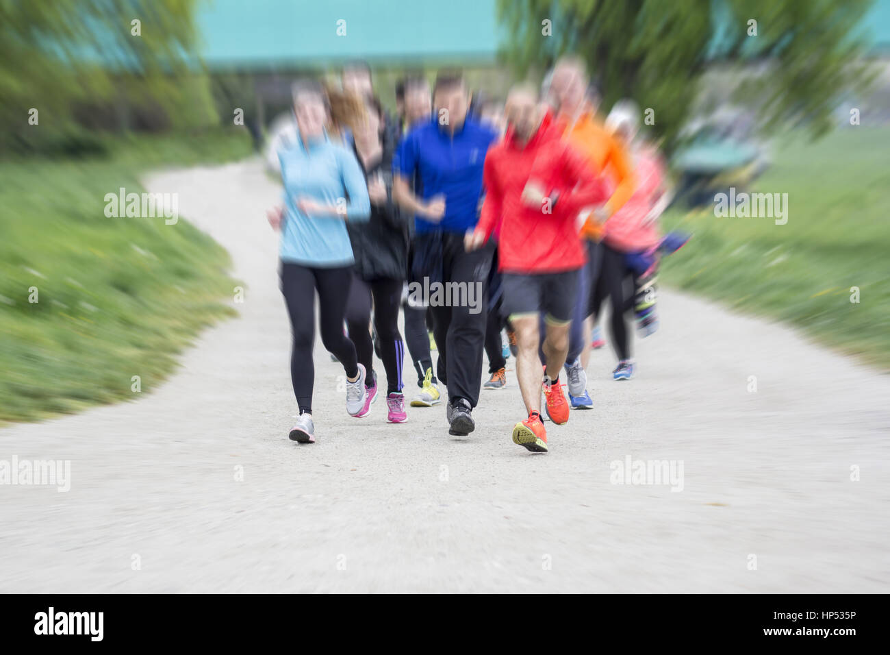 Fitness sport Group of people running jogging outside on road Stock Photo