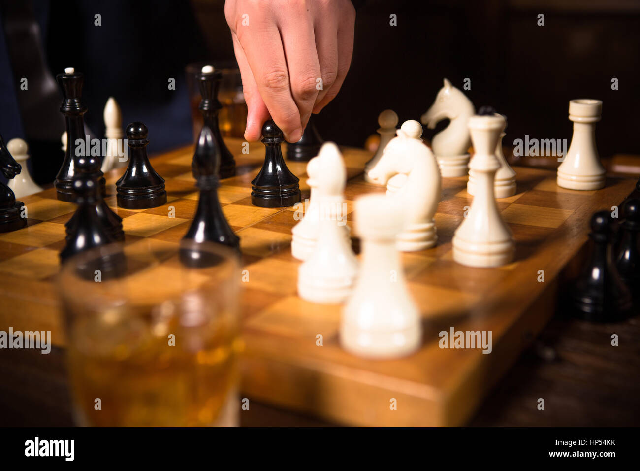 Rich businessmen playing chess Stock Photo
