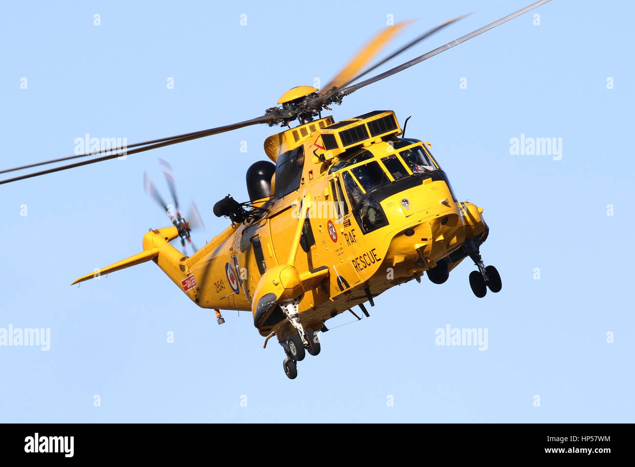 RAF Search and Rescue Sea King HAR3A from 'B' Flight, 22 Sqn at Wattisham Airfield, Suffolk making a circuit to the runway on a clear Sunday morning. Stock Photo