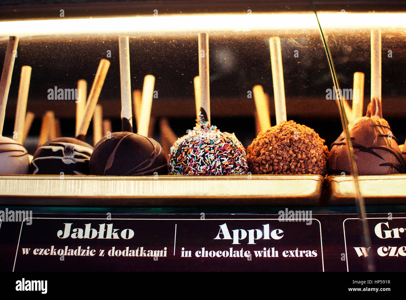 Delicious local street food taffy apple in chocolate with extras, sweets in Zakopane, Poland. Stock Photo
