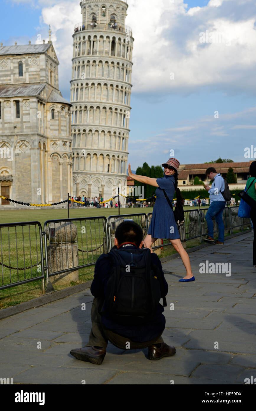Asian tourist pretend pretending staight straighten Leaning Tower Piazza dei Miracoli Pisa Italy RM World Stock Photo