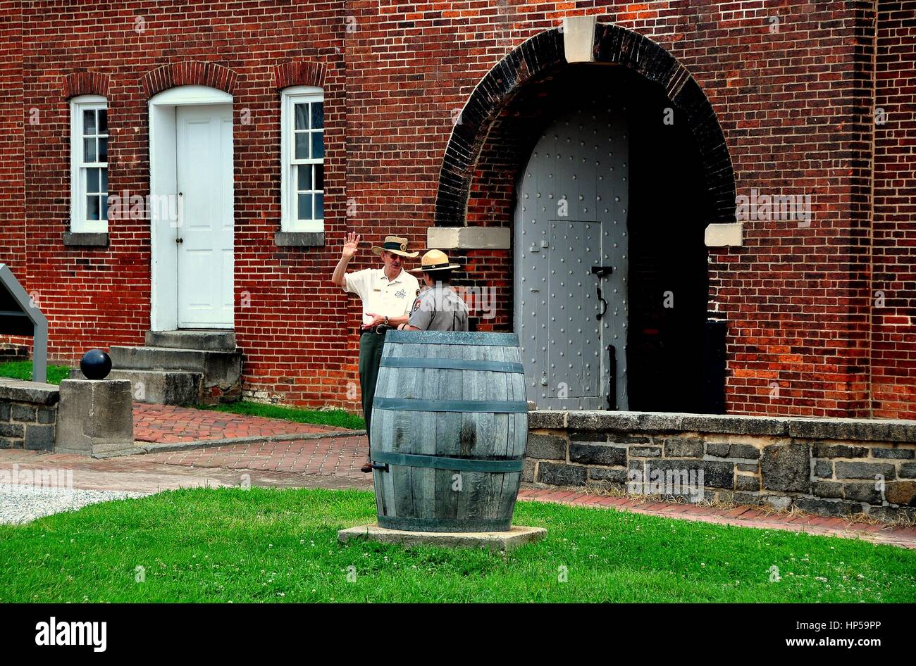 Baltimore, Maryland - July 24, 2013:  Two U. S. Park Rangers stand at the sally port entrance to historic c. 1790 Fort McHenry Stock Photo