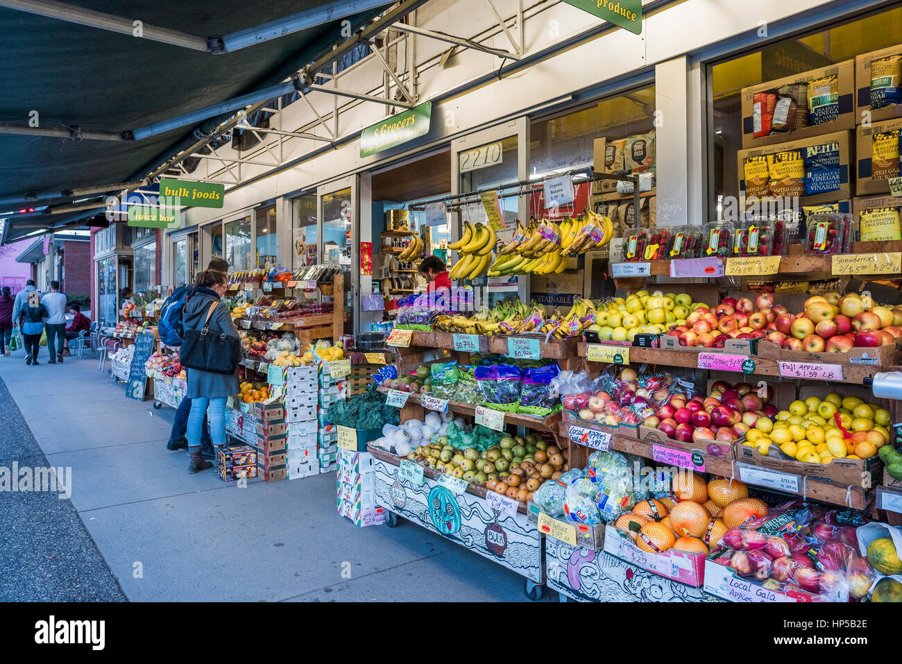 Fruit displays outside Dollar Grocers, Commercial Drive, Vancouver