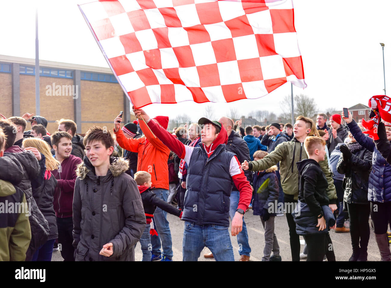 Lincoln, UK. 18th Feb, 2017. Non-league Lincoln city FC supporters celebrate shock win over Premier League club Burnley and a place in the FA Cup quarter-finals. Fans celebrate outside Sincil bank stadium home of the Imps, after watching the game via large screen TV. Credit: Ian Francis/Alamy Live News Stock Photo