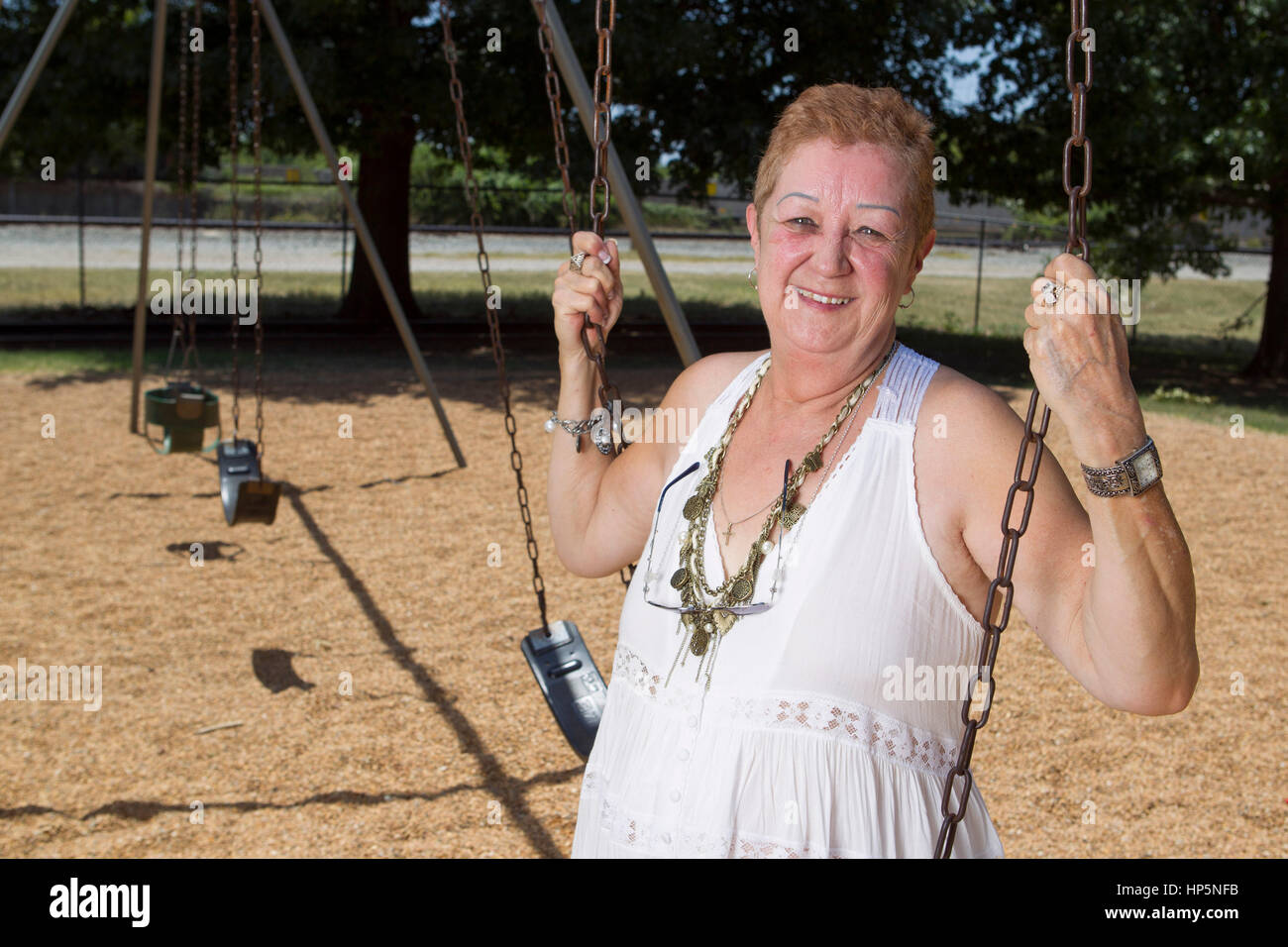 Smithville, Texas, USA. July 15, 2011. Norma McCorvey, the anonymous plaintiff known as Jane Roe in the Supreme Court's landmark 1973 Roe vs. Wade ruling legalizing abortion in the United States, swings in a local park.  McCorvey died, Feb. 18, 2017 in an assisted living center in Katy, Texas Credit: Bob Daemmrich/Alamy Live News Stock Photo