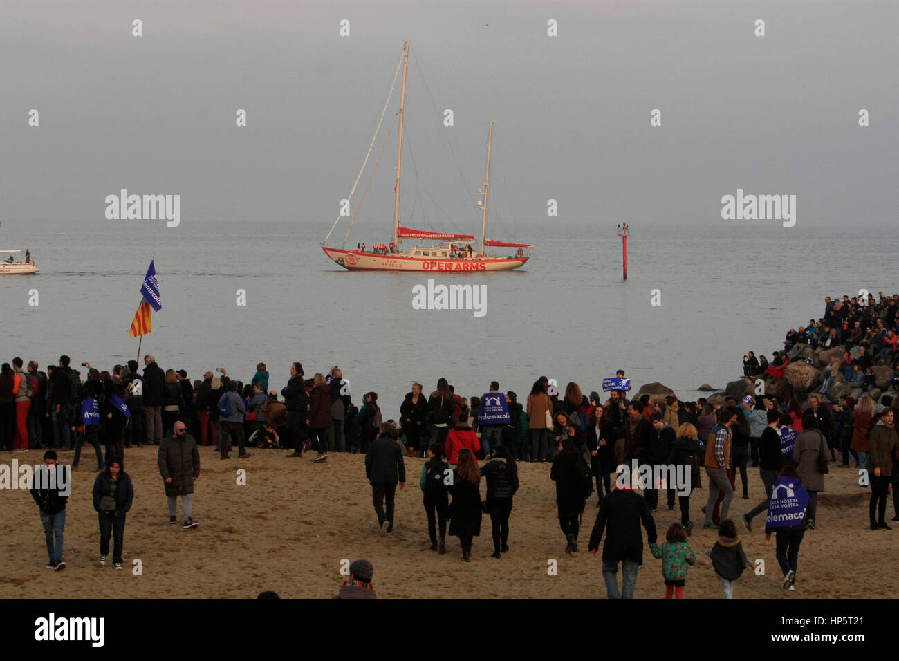 Barcelona, Spain. 18th Feb, 2017. At Barcelona beach, volunteers act out a rescue from small boat on the beach. Around 160,000 people demonstrate on Via Laietana, central Barcelona, demanding the government to allow more refugees and to show support for refugees escaping the atrocities in war torn areas such as Syria. Credit: rich bowen/Alamy Live News Stock Photo