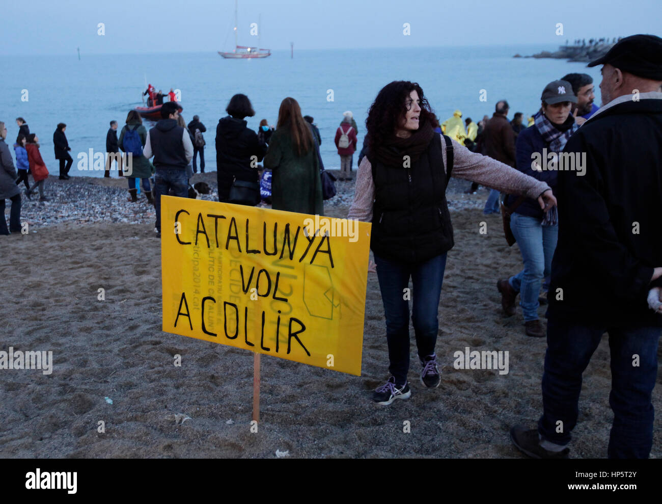Barcelona, Spain. 18th Feb, 2017. At Barcelona beach, volunteers act out a rescue from small boat on the beach. Around 160,000 people demonstrate on Via Laietana, central Barcelona, demanding the government to allow more refugees and to show support for refugees escaping the atrocities in war torn areas such as Syria. Credit: rich bowen/Alamy Live News Stock Photo