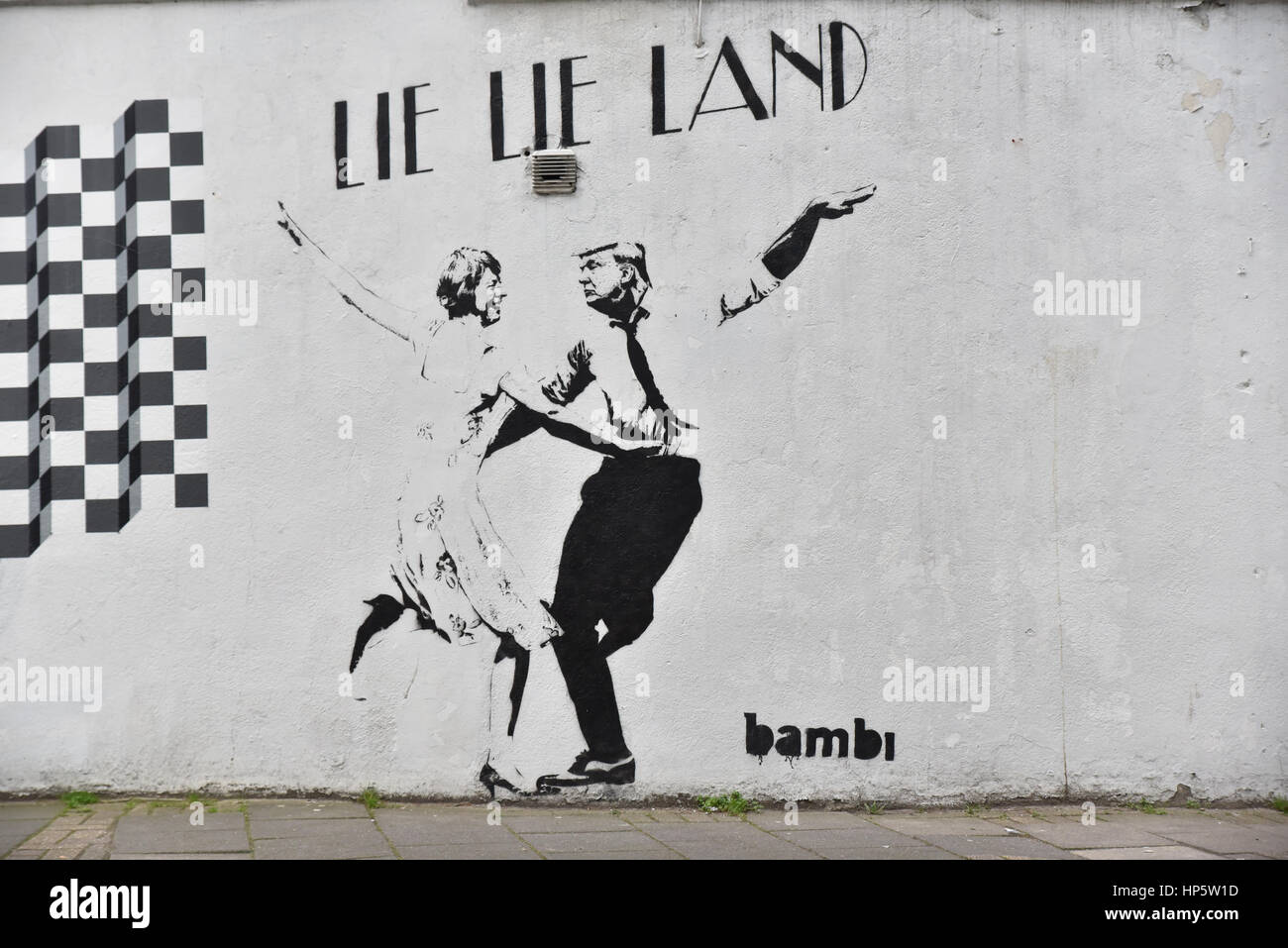 Islington, London, UK. 19th February 2017. New Graffiti by artist Bambi has appeared in Islington portraying the PM Theresa May and US President Donald Trump in a caricature of the movie as  'Lie Lie Land'. Credit: Matthew Chattle/Alamy Live News Stock Photo