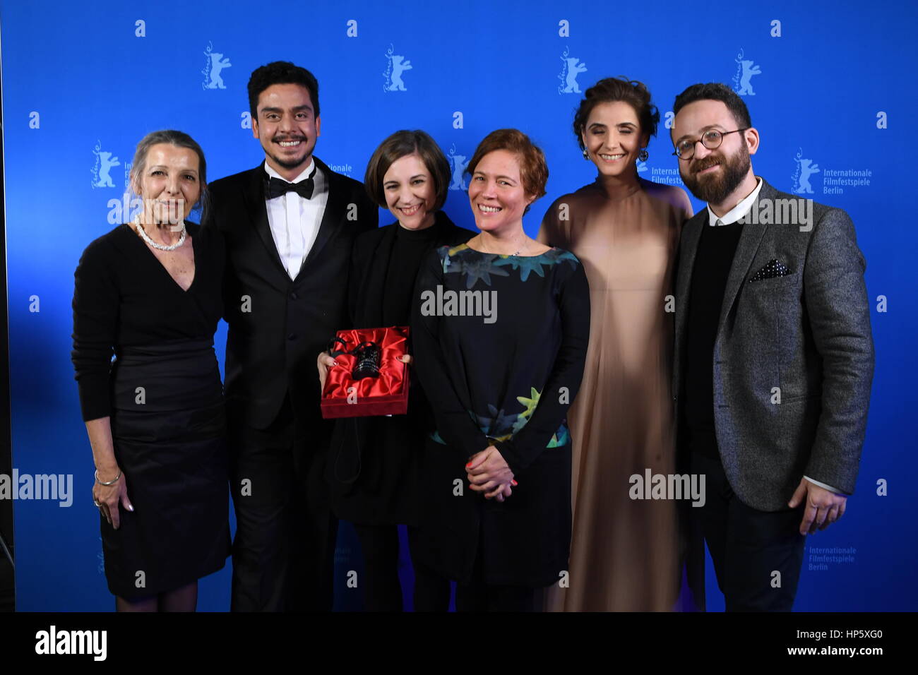 Berlin, Germany. 18th Feb, 2017. Director Carla Simon (center l), who received an award for Best Newcomer for the movie 'Summer 1993'/'Estiu 1993', poses with producer Valerie Delpiere (c) and her team (not identified) at the 67th International Berlin Film Festival in Berlin, Germany, 18 February 2017. 18 movies ran in the competition of the Berlinale film festival. Photo: Britta Pedersen/dpa-Zentralbild/dpa/Alamy Live News Stock Photo