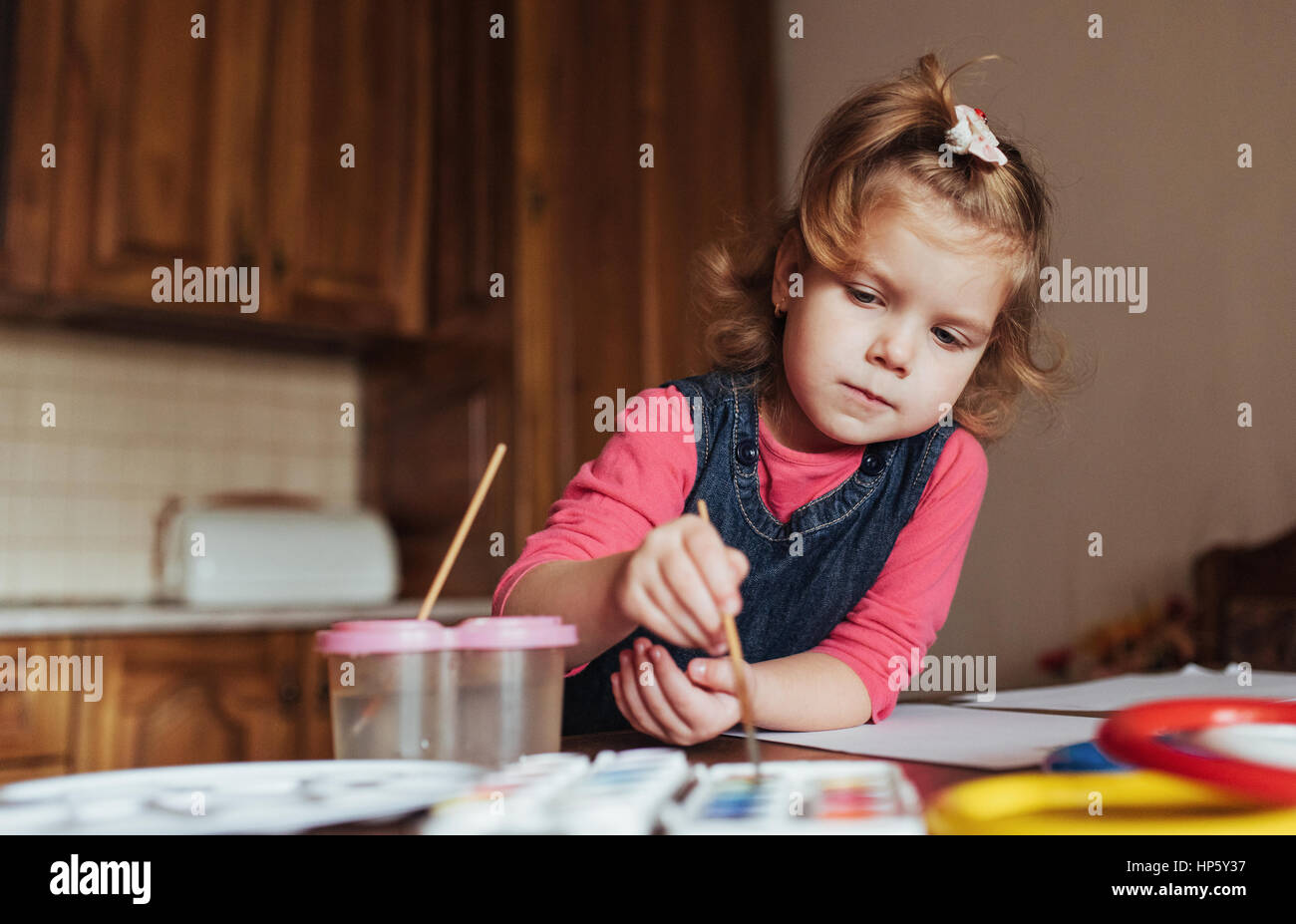Cute little girl, adorable preschooler painting with watercolors Stock ...