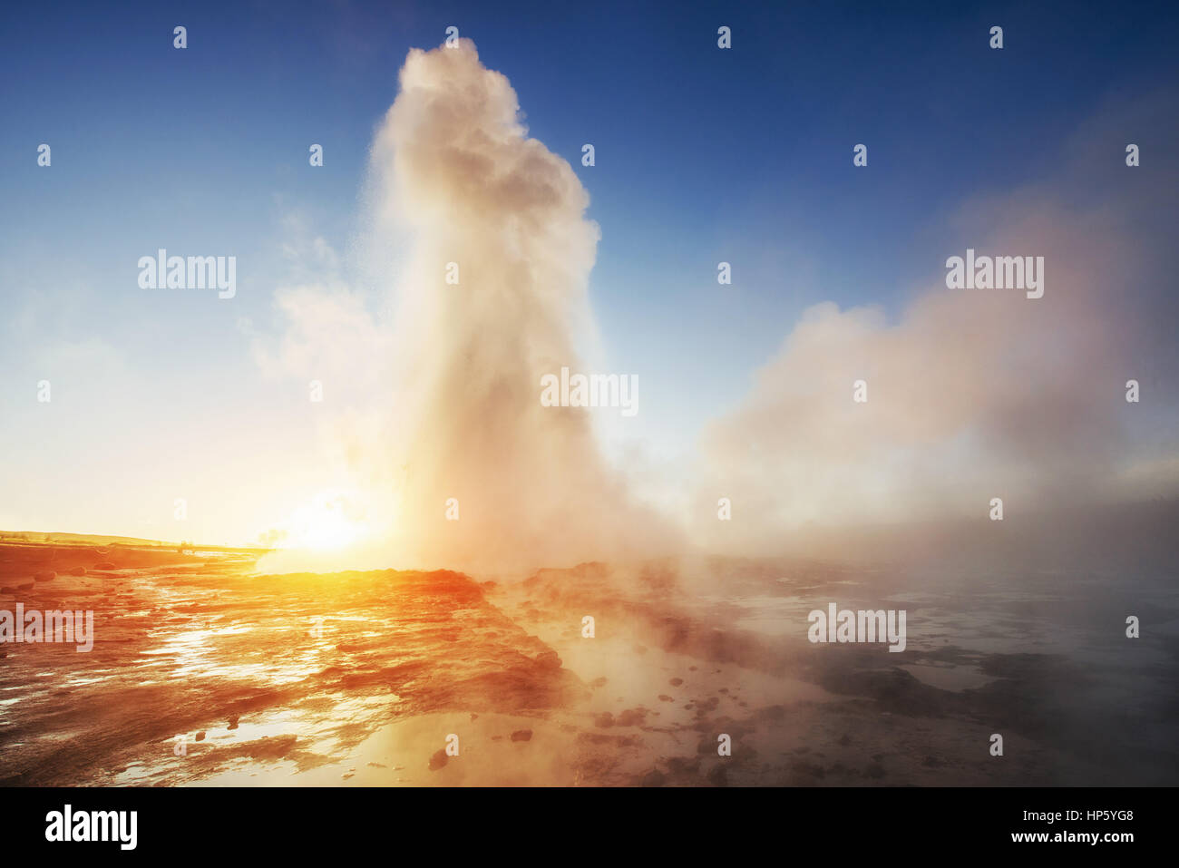 geysers in Iceland. Fantastic kolory.Turysty watch the beauty of Stock Photo