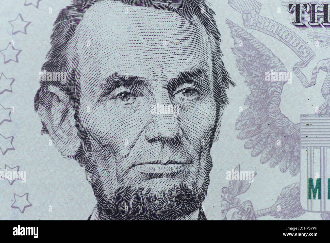 US President Abraham Lincoln face on five dollar bill macro, 5 u Stock Photo