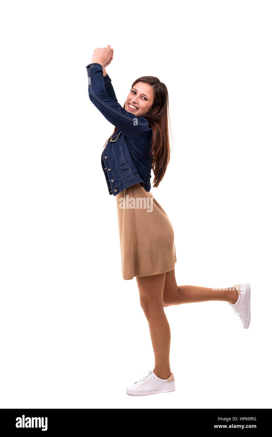 Studio shot: Happy woman with raised arms Stock Photo - Alamy