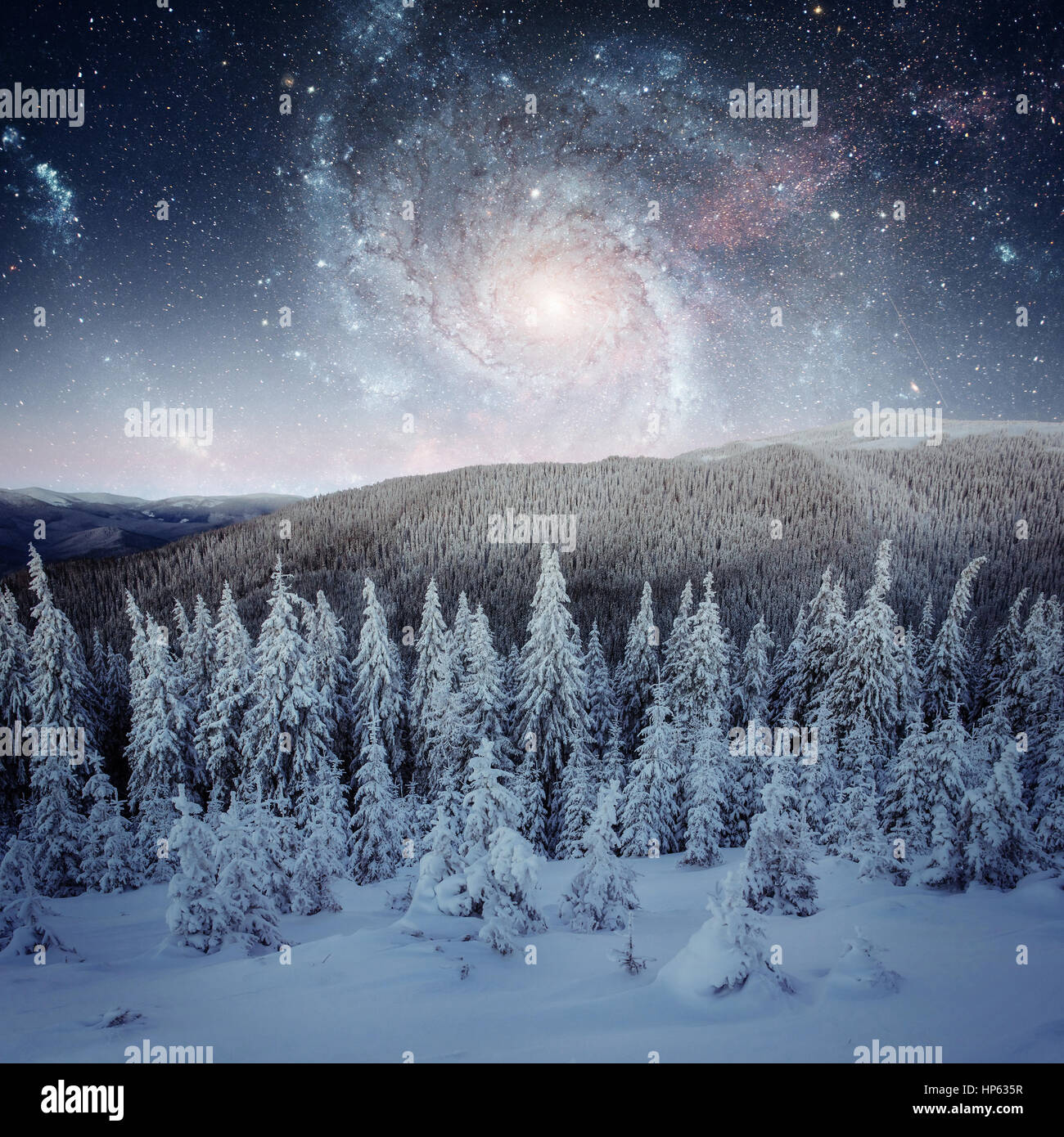 Fantastic starry sky. Beautiful winter landscape and snow-capped Stock Photo